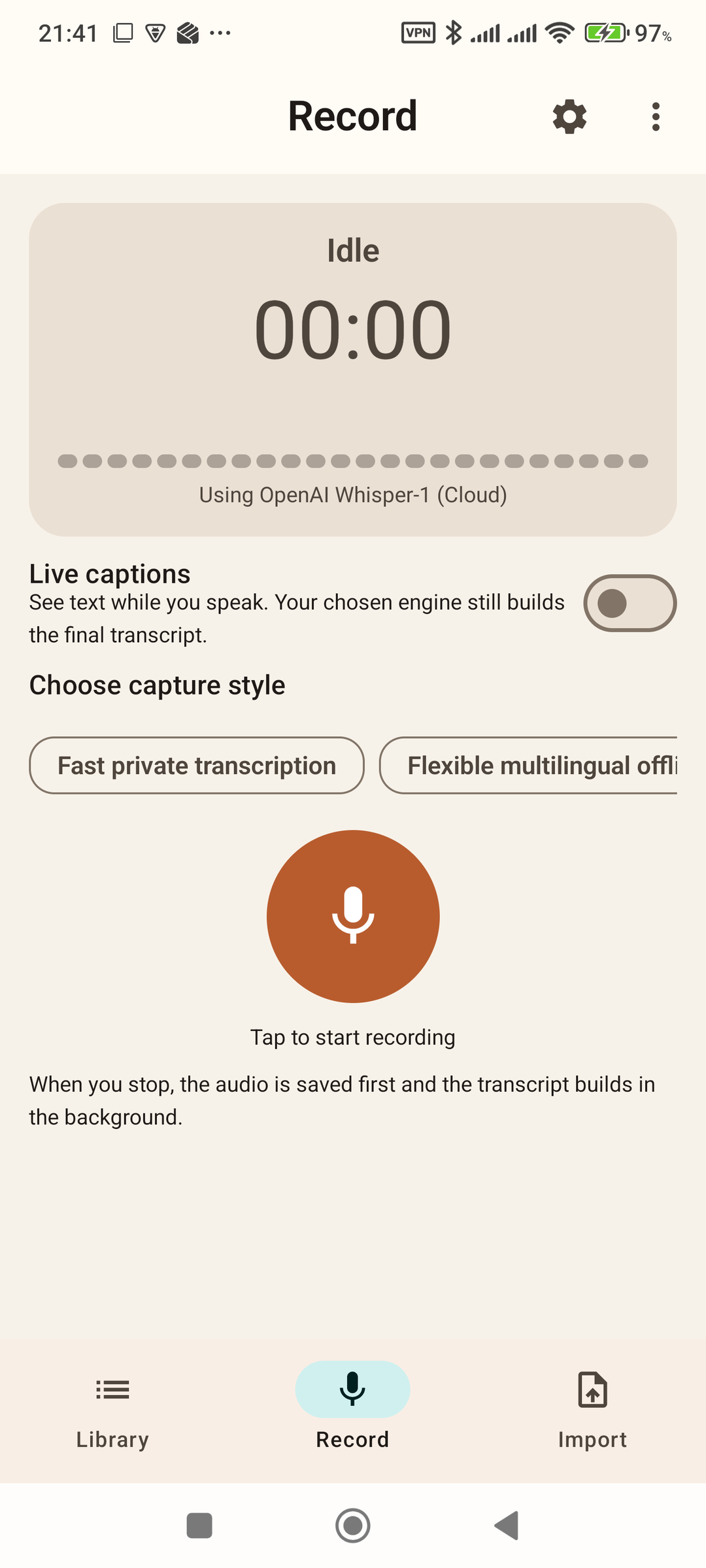 Record screen showing the capture style chips, live captions toggle, and the large circular record button.